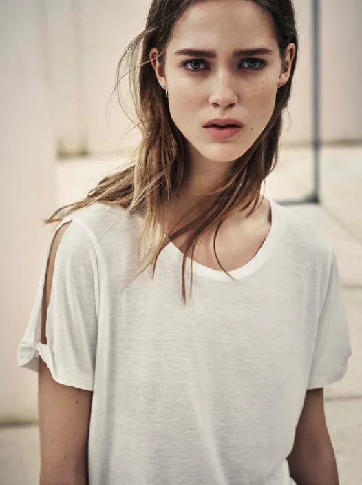 Model in a loose white T-shirt