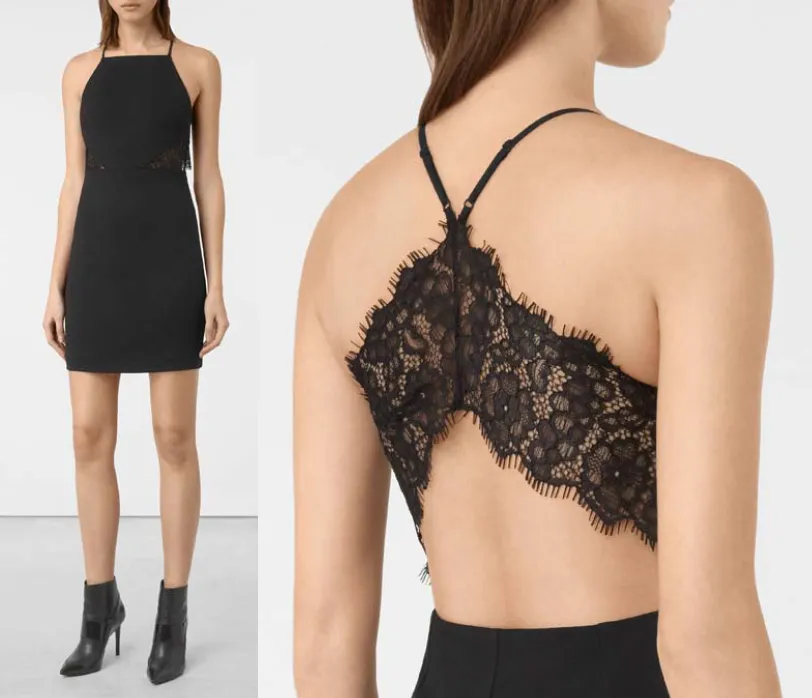 Model in a black mini dress with a lace back