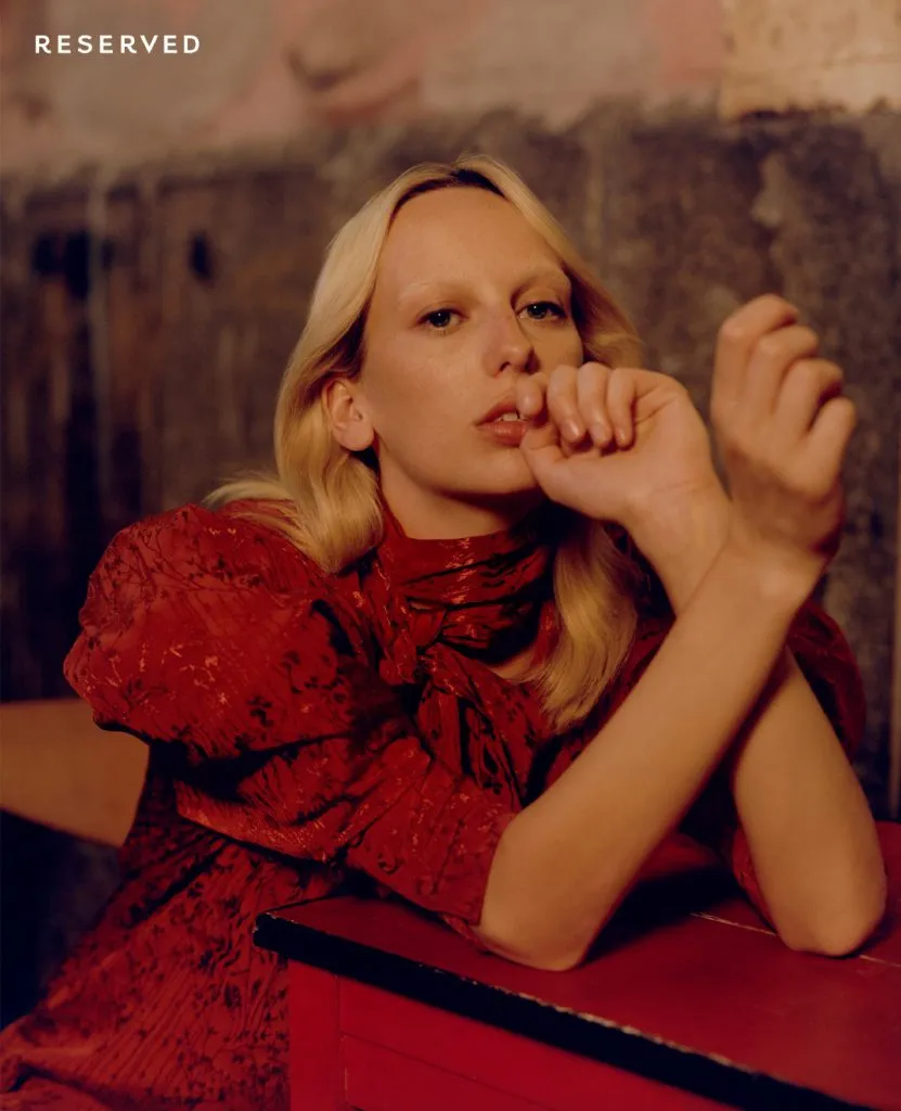 Model in a red lace dress